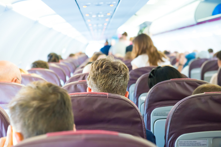 Group of Passengers inside Airplane