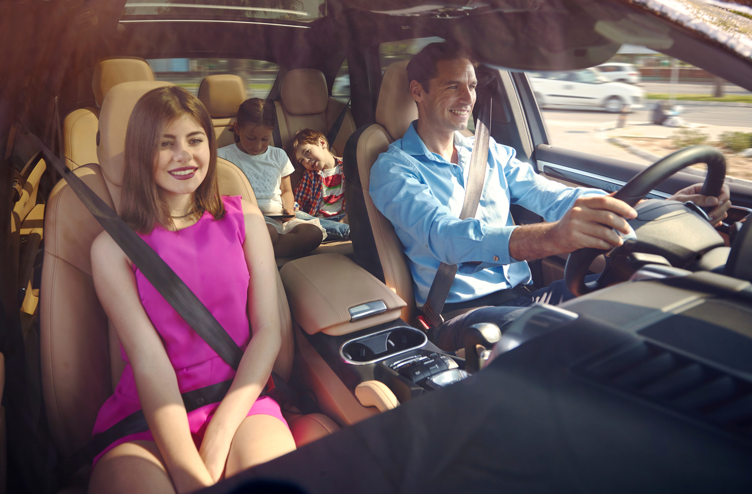 Happy family inside car